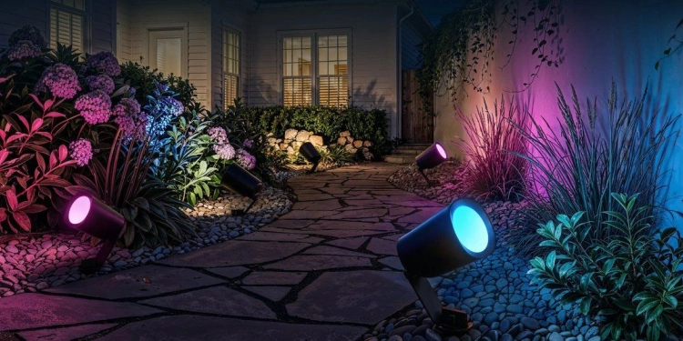 Matter-compatible Govee Outdoor Spotlights Lite displayed along a garden path