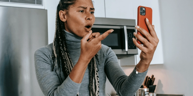 Woman upset with phone