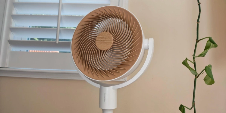 SwitchBot Circulator Floor Fan in front of a window 