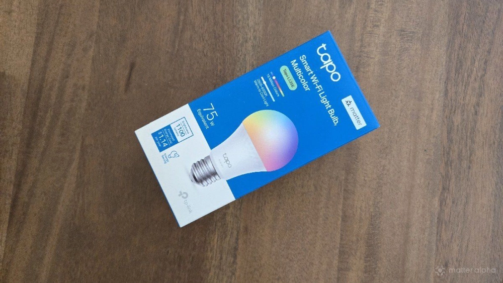 A tapo l535e smart bulb on a table
