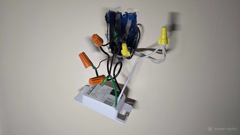 A tapo smart switch hanging out of a wall A tapo smart switch hanging out of a wall