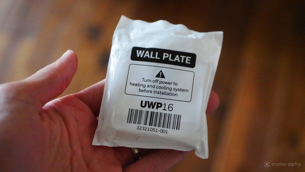 A Honeywell Home UWP wall plate still in its packaging.