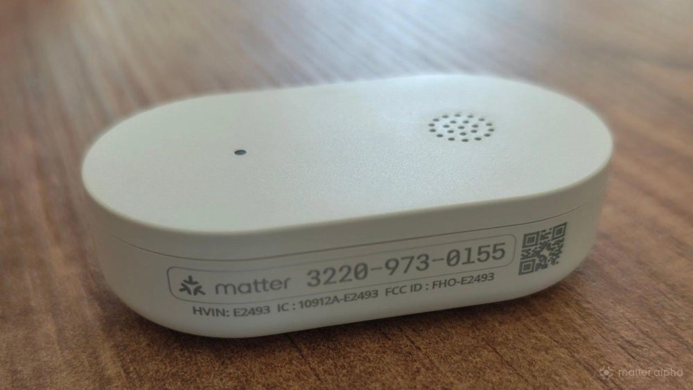 Matter pairing code on the side of an ikea klippbok water sensor
