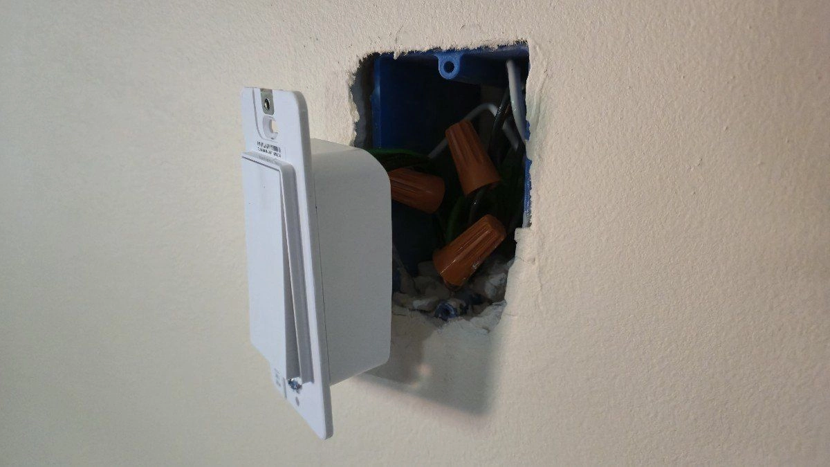 A tapo s505 smart light hanging out of a wall
