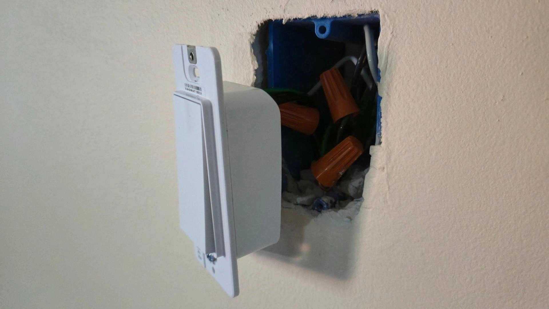 A tapo smart light switch during installation