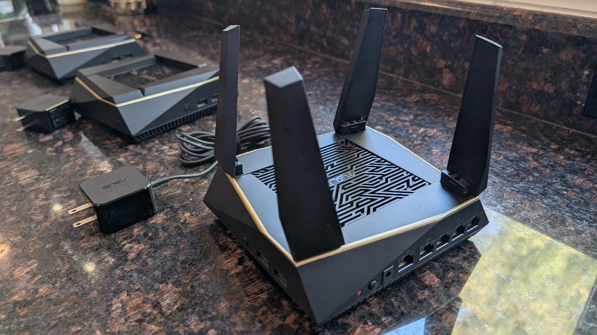 Asus rt ax92u ax6100 mesh wi fi on a countertop