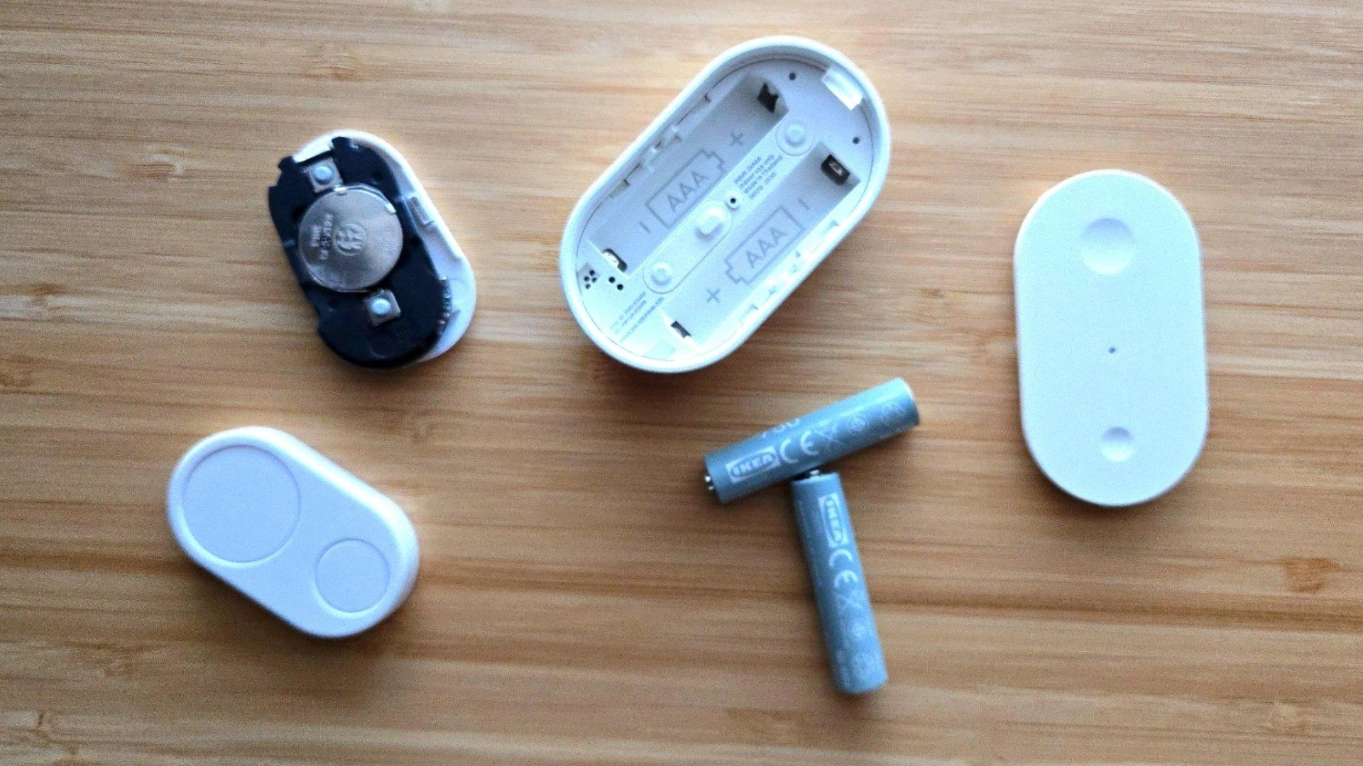 Flic duo and ikea bilresa smart buttons with batteries visible