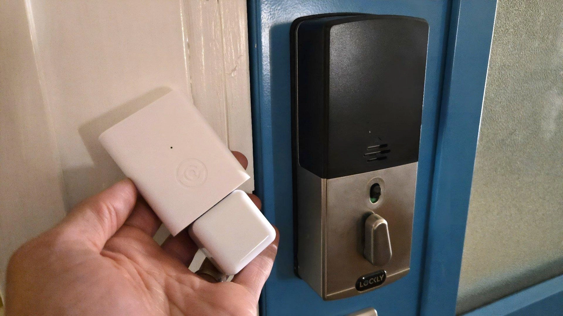 Lockly matter link next to a lockly secure plus smart lock