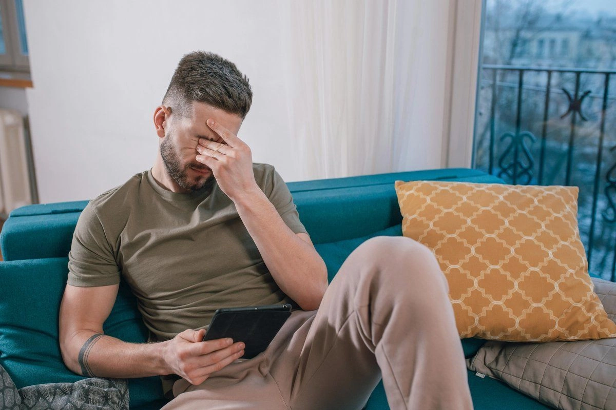 Sad man on couch