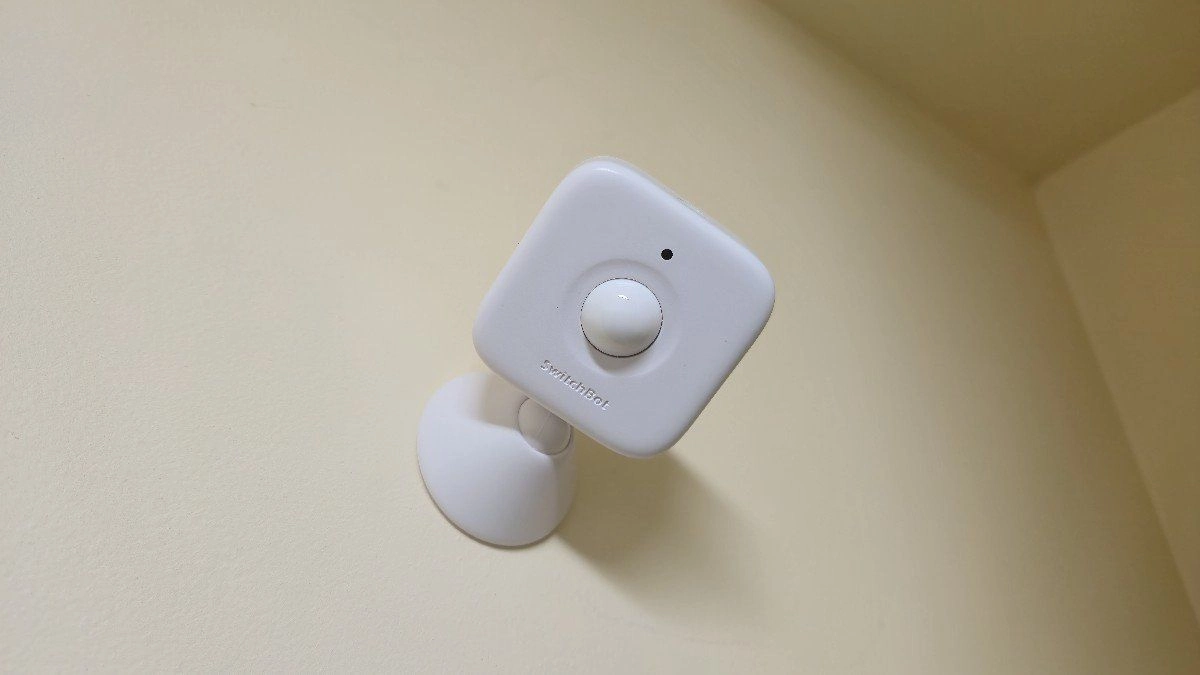 The switchbot motion sensor mounted up high in a closet
