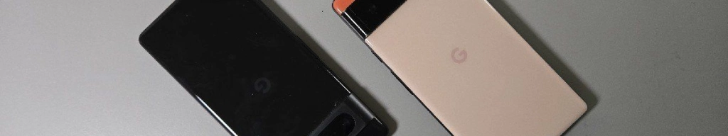 A black google pixel 7 next to a pink pixel 6