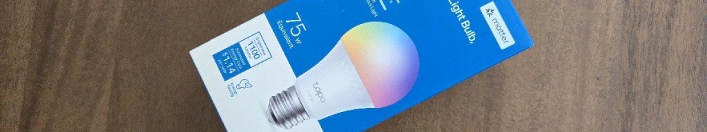 A tapo l535e smart bulb on a table