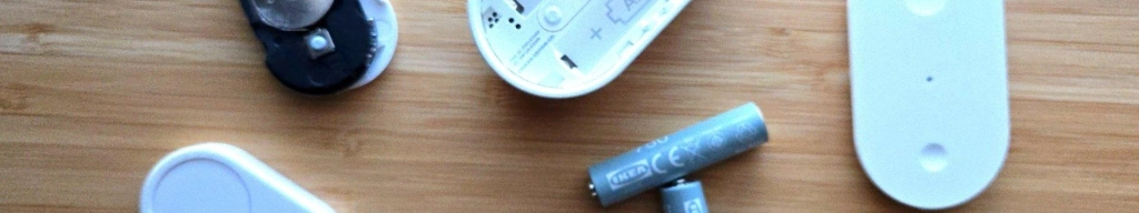 Flic duo and ikea bilresa smart buttons with batteries visible