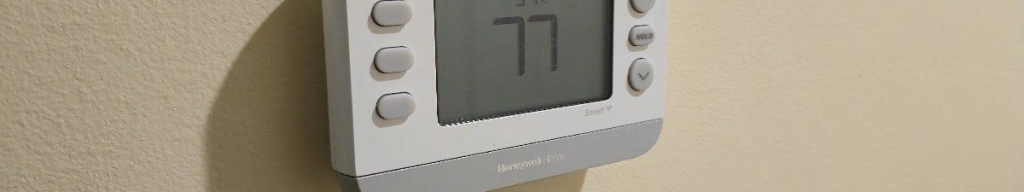 Honeywell smart x2s matter compatible thermostat mounted on a wall