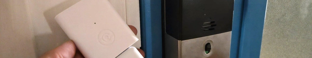 Lockly matter link next to a lockly secure plus smart lock