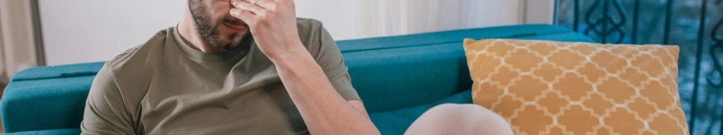 Sad man on couch