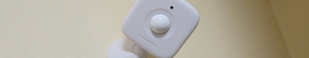 The switchbot motion sensor mounted up high in a closet