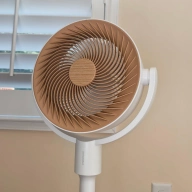 SwitchBot Circulator Floor Fan in front of a window 