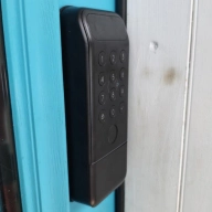 A SwitchBot Lock Vision Pro keypad.