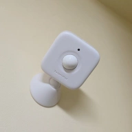 The switchbot motion sensor mounted up high in a closet