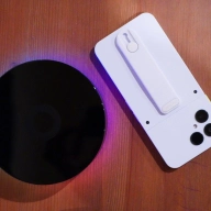 Top down view of a homey pro next to a fairphone 6