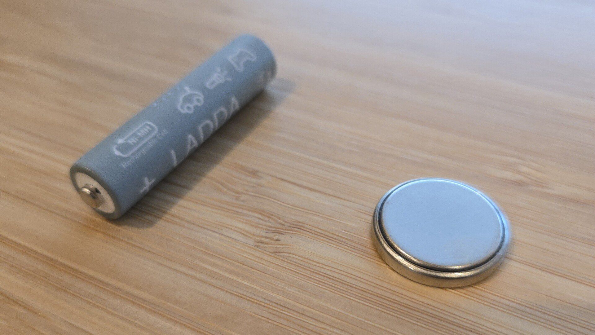 Ikea ladda aaa battery next to a CR2032 coin battery Ikea ladda aaa battery next to a CR2032 coin battery
