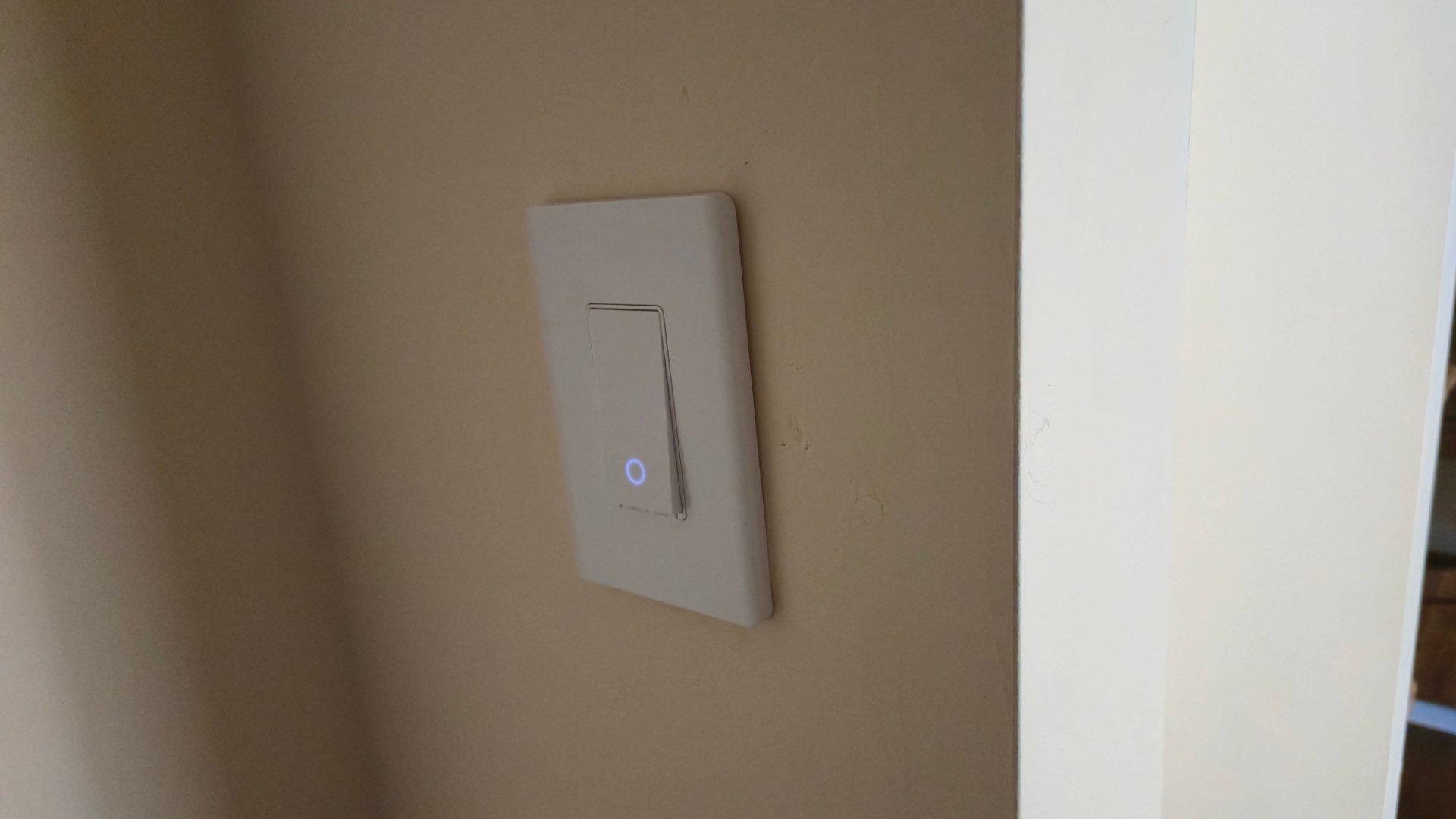 The ring shaped light on a tapo light switch glowing in the dark The ring shaped light on a tapo light switch glowing in the dark